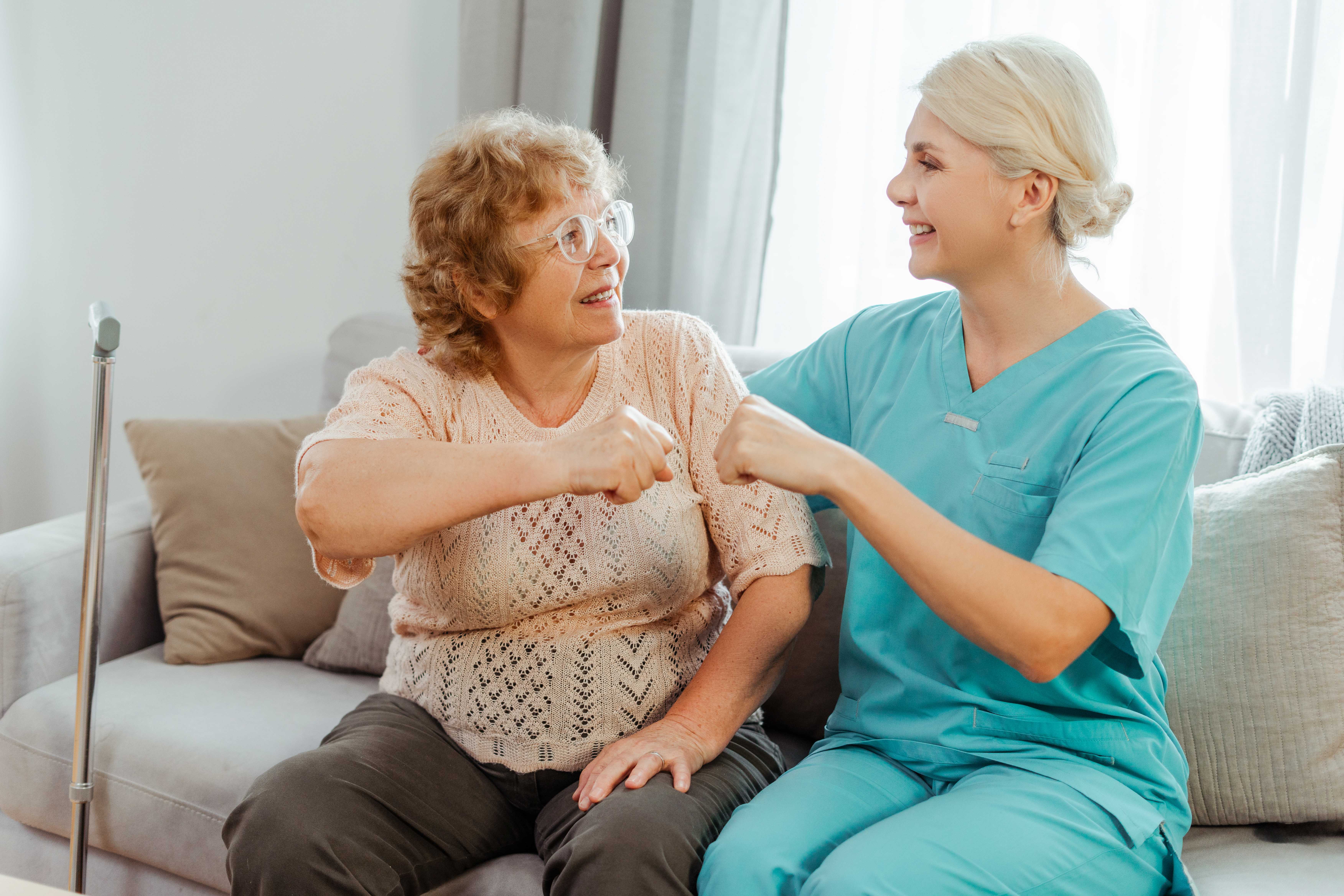 nurse-and-senior-woman-celebrating